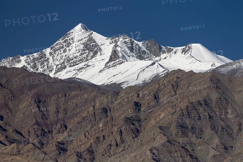 Stok Kangri, the highest peak in the Stok Range of the Zanskar Mountains in the Himalayas and a popular trekking six-thousander, seen from the Shey village, located in the Indus Valley. Leh District, Union Territory of Ladakh, India, Asia