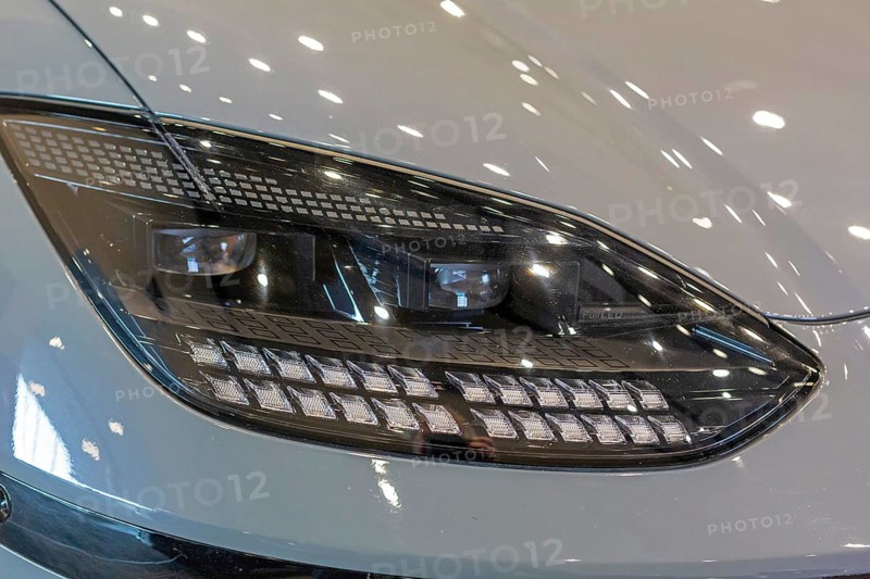 Pontiac, Michigan USA, 4 January 2024, A headlight of the Hyundai Ioniq 6 electric car, which was runner-up in the North American Car of the Year award. The annual North American Car, Truck and Utility Vehicle of the Year (NACTOY) awards are judged by a panel of professional automotive journalists