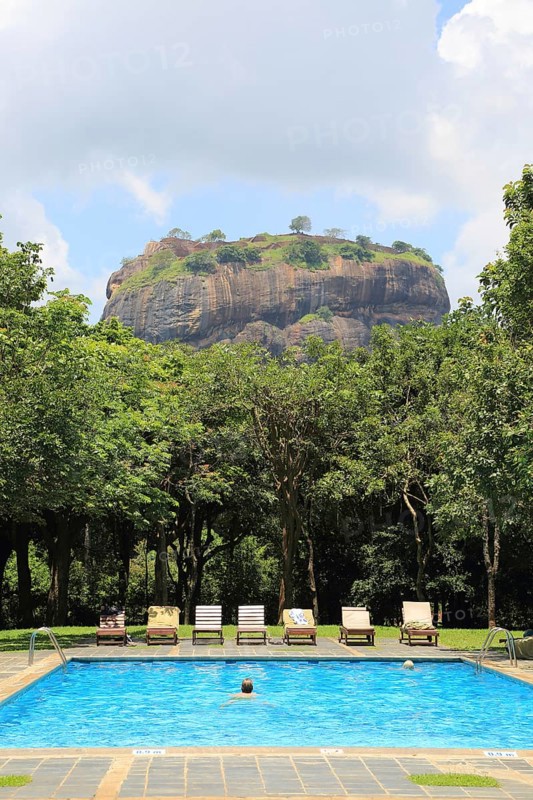 Swimming pool view to Rock Palace at Hotel Sigiriya, Sigiriya, Central Province, Sri Lanka, Asia