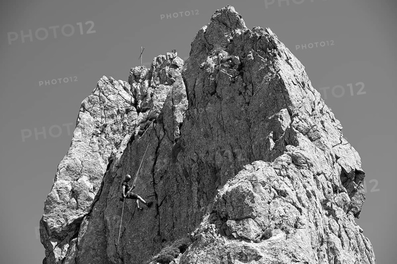 Climber abseiling on the Rosssteinnadel, mountaineering village Kreuth, Mangfall mountains, Bavarian Prealps, Upper Bavaria, Bavaria, Germany, Europe