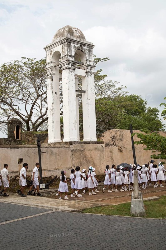 School children in uniform walking in a street in the historic town of Galle, Sri Lanka, Asia