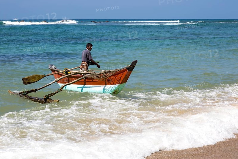 Fishing using traditional outrigger canoes, Mirissa, Sri Lanka, Asia