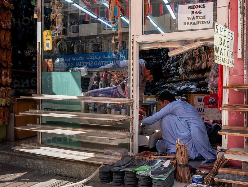 Shoe shops and craftsmen in the Al Fahidi neighbourhood, Dubai, United Arab Emirates, Asia