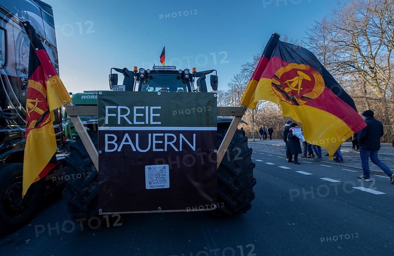 Germany, Berlin, 08.01.2024, Protest of farmers in front of the Brandenburg Gate, nationwide protest week against policies of the traffic light government and cuts for farms, GDR flags, Europe