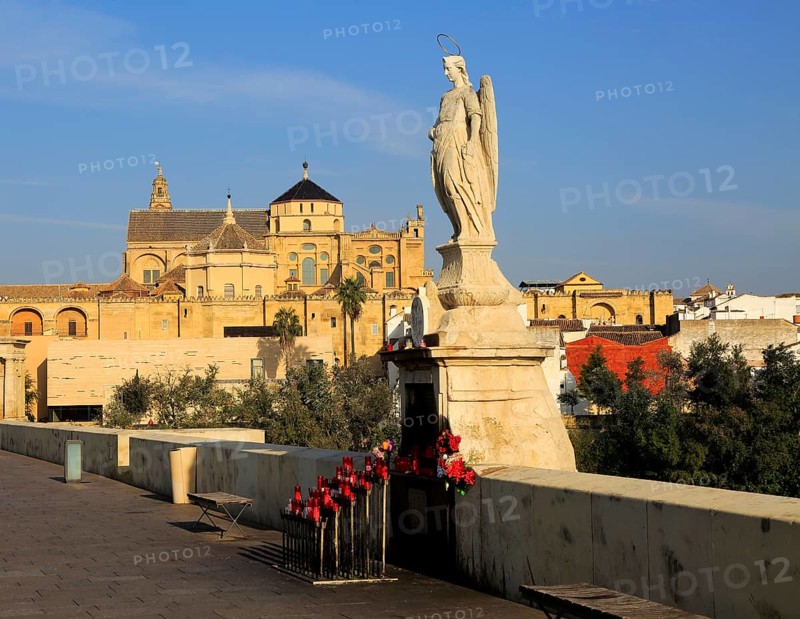 Angel San Rafael statue on Roman bridge with views cathedral, Cordoba, Spain, Europe