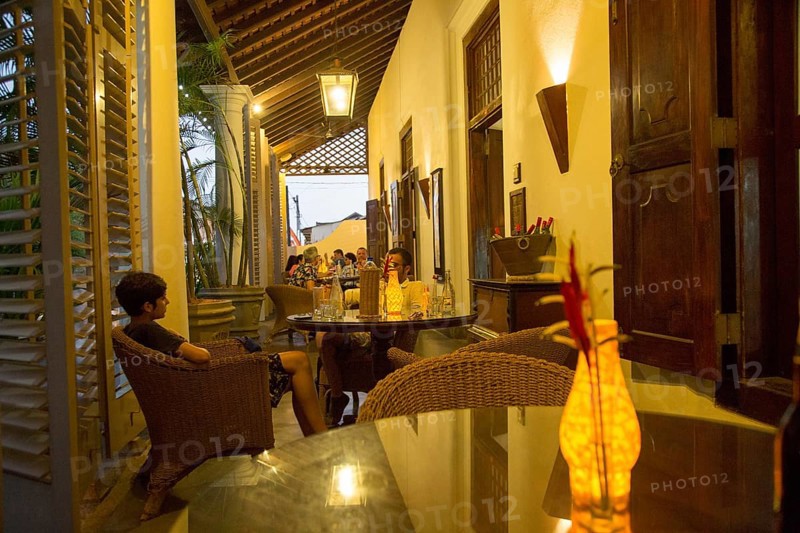 Evening drinks colonial style veranda bar of Galle Fort Hotel, historic town of Galle, Sri Lanka, Asia