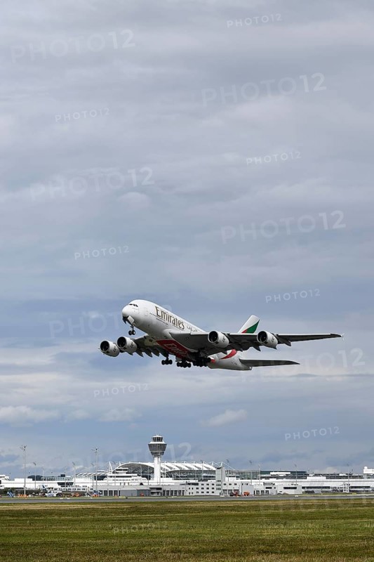 Emirates Airways Airbus A380-800 take-off on southern runway with control tower, Munich Airport, Upper Bavaria, Bavaria, Germany, Europe