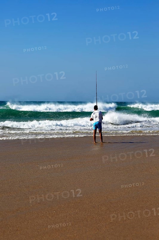 Man fishing from the beach at Conil de la Frontera, Cadiz province, Spain, Europe
