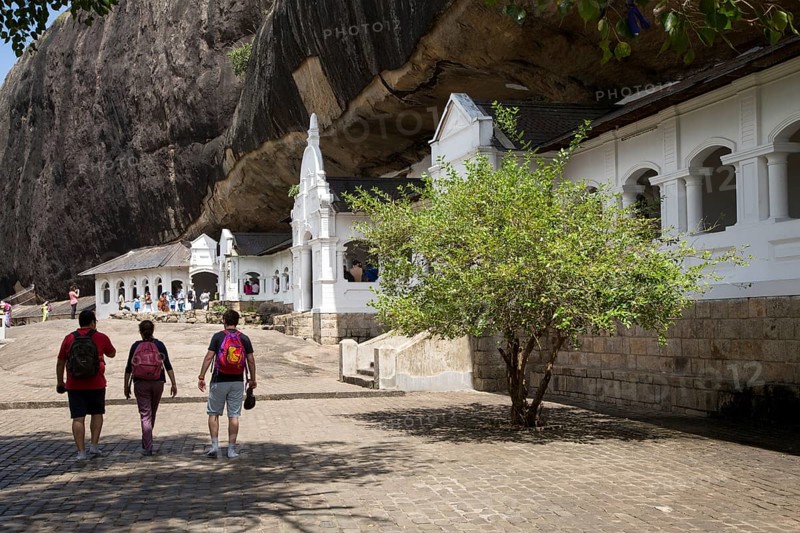 People at Dambulla cave Buddhist temple complex, Sri Lanka, Asia
