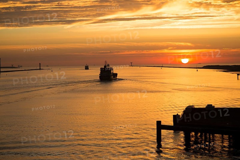 Sunset orange glow landscape clouds water, North Sea shipping, Port of Rotterdam, Hook of Holland, Netherlands