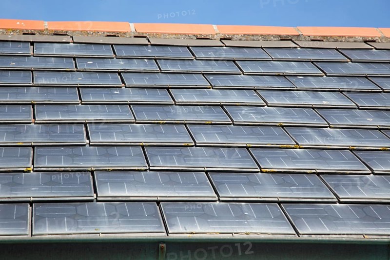 Close up of photovoltaic roof tiles on building, Kynance Cove, Cornwall, England, UK