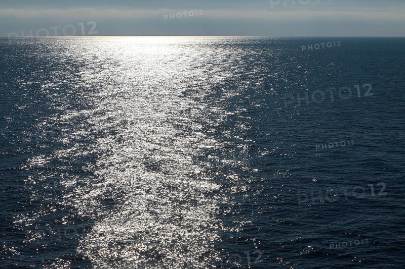 Sunlight at dusk on calm water of the Mediterranean Sea
