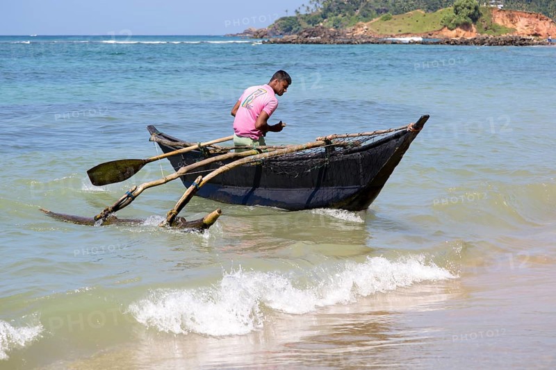 Fishing using traditional outrigger canoes, Mirissa, Sri Lanka, Asia