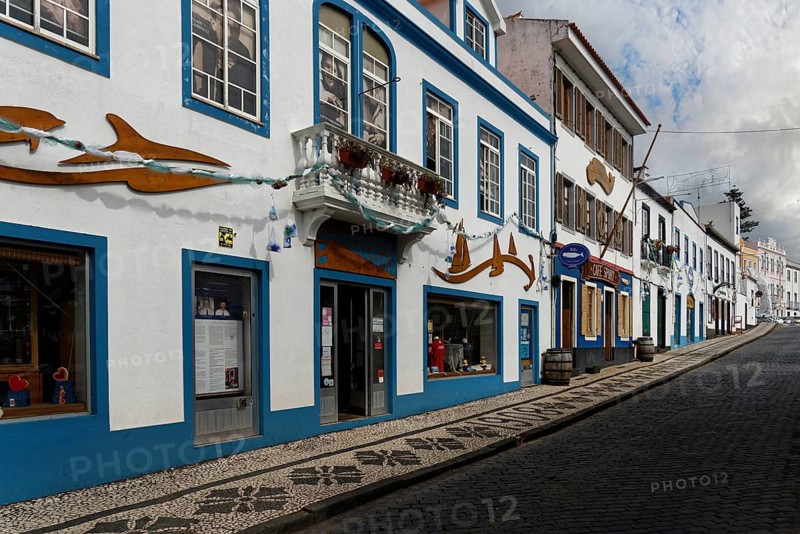 Street view with traditional with the famous Cafe Sport, blue decorated buildings and cobbled path, Horta, Faial Island, Azores, Portugal, Europe