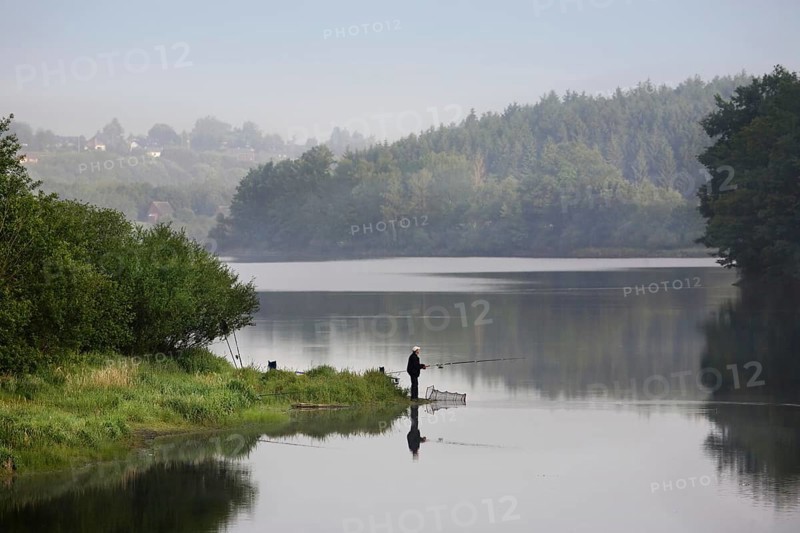 Angler at the Buetgenbach reservoir in the Hautes Fagnes, High Fens, Ardennes, Belgium, Europe