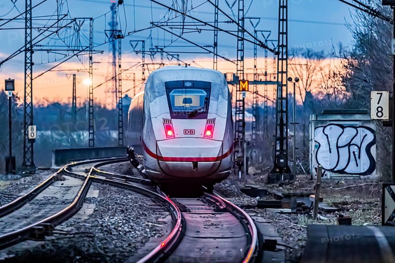 Railway line with many overhead lines and railway signals, InterCityExpress ICE of Deutsche Bahn AG, rear lights in the evening light, Stuttgart, Baden-Wuerttemberg, Germany, Europe