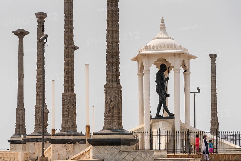 Child at the foot of a Mahatma Gandhi monument, statue, former French colony of Pondicherry or Puducherry, Tamil Nadu, India, Asia