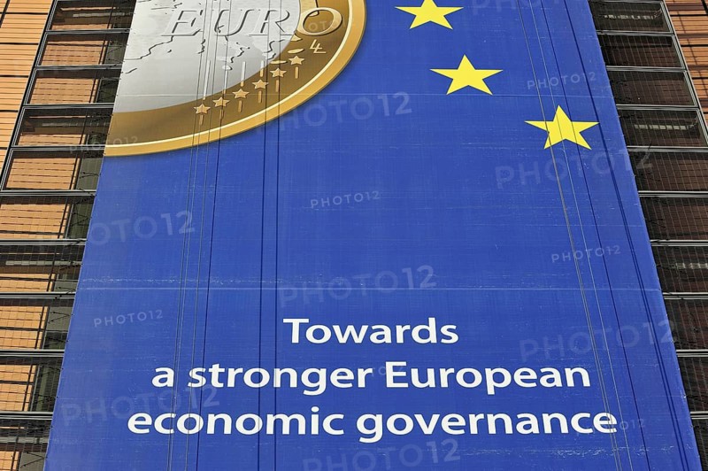 Banner about the euro hanging from the Berlaymont building of the European Commission, executive body of the European Union, Brussels, Belgium, Europe