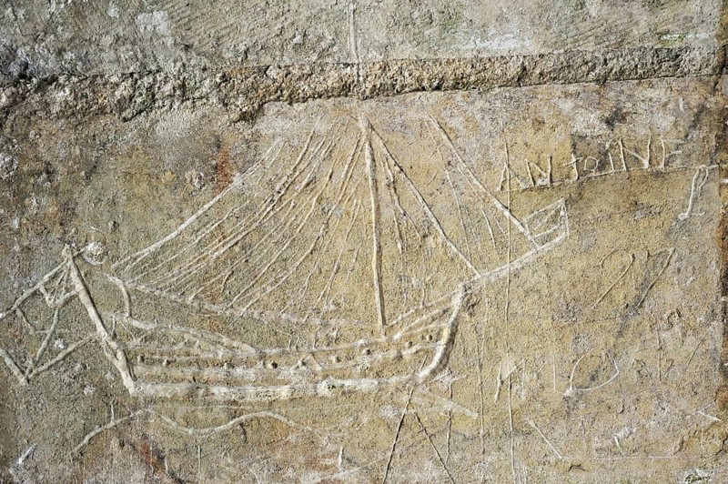 Old graffiti of galleon sailing ship carved on rampart wall of the citadel at Brouage, Hiers-Brouage, Charente-Maritime, France, Europe