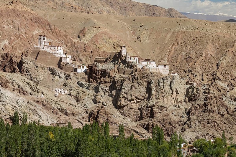 Basgo Gompa, the Buddhist monastery and fortress in Central Ladakh, with the village below it and rugged mountain landscape around. Leh District, Union Territory of Ladakh, India, Asia