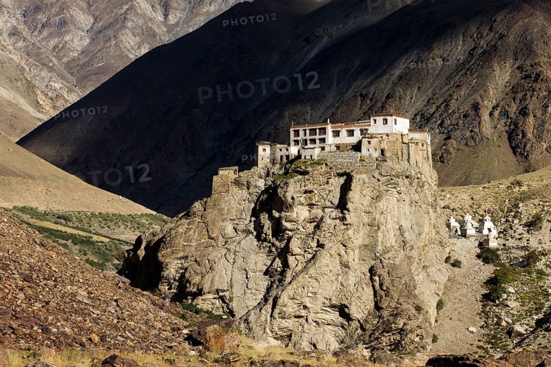 Bardan Gompa, the dramatically located Buddhist monastery of the Bardan village in Zanskar, the sub-region of Ladakh in Northern India. Many inhabitants of the region, also called Little Tibet, follow Tibetan Buddhism and this monastery belong to the Drukpa Lineage, order or sect of the Kagyu tradition. Photographed late in the summer. Lungnak Valley in the Zanskar Range of the Himalayas. Kargil District, Union Territory of Ladakh, India, Asia