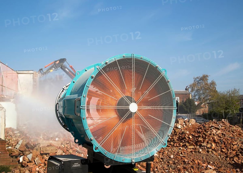 Dehaco water cannon sprayer dampening dust at a demolition site, Woodbridge, Suffolk, England, UK