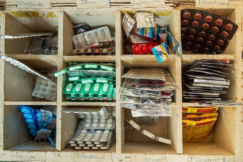 Tablets in a wooden box with compartments, rural health centre, Tamil Nadu, India, Asia