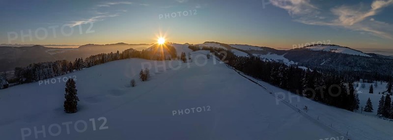 Sunset over the second Jura chain in winter, foreground contours of sinkholes, view towards the first Jura chain with Weissenstein, drone image, Brunnersberg, Solothurn, Switzerland, Europe