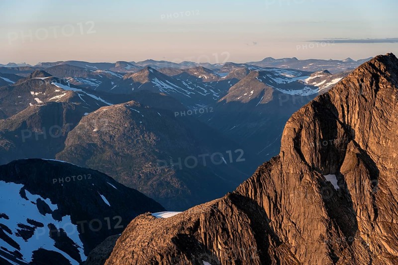 Mountain peak in soft evening light, view from the summit of Skala at sunset, Loen, Norway, Europe