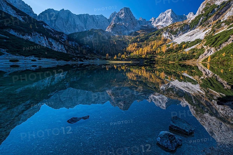 Mountains reflected in mountain lake, sun, autumn, Seebensee, Mieminger Kette, Tyrol, Austria, Europe