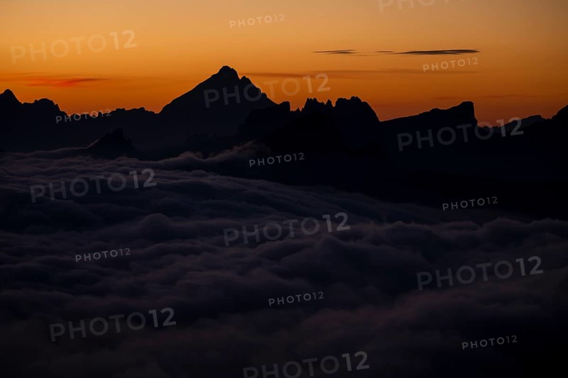 Sunrise over a sea of fog and Dolomite peaks in the background, Corvara, Dolomites, Italy, Europe