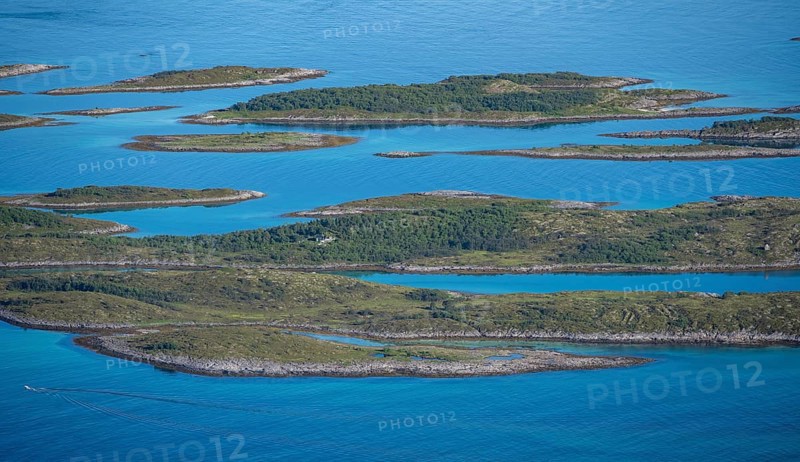 Rocky islands in the blue sea, sea with archipelago islands, Ulvagsundet, Vesteralen, Norway, Europe