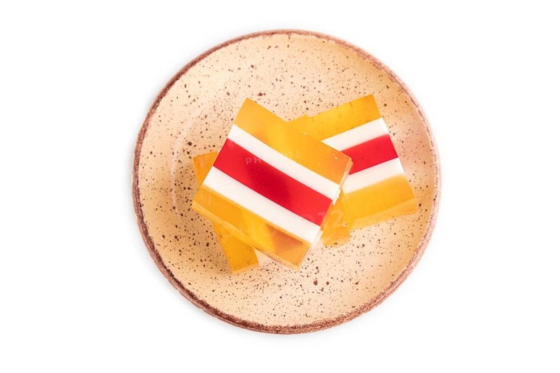 Almond milk and peach jelly isolated on white background. top view, flat lay, close up