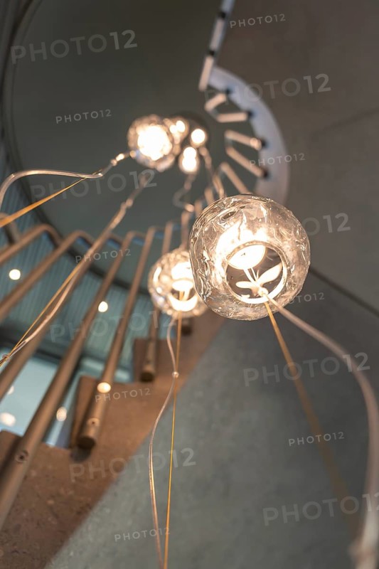 Modern Illuminated Hanging Lamp in Concrete Spiral Staircase with Railing in Switzerland