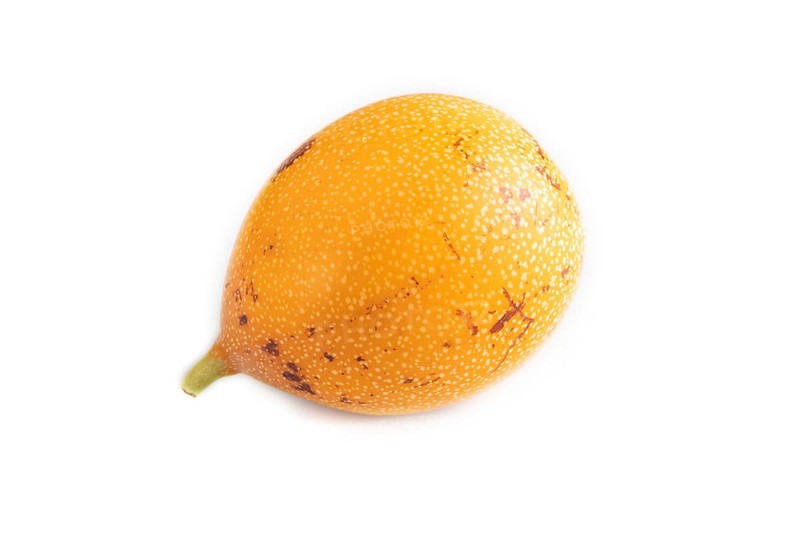 Granadilla isolated on white background. Side view. Tropical, healthy food, summer, exotic, minimalism