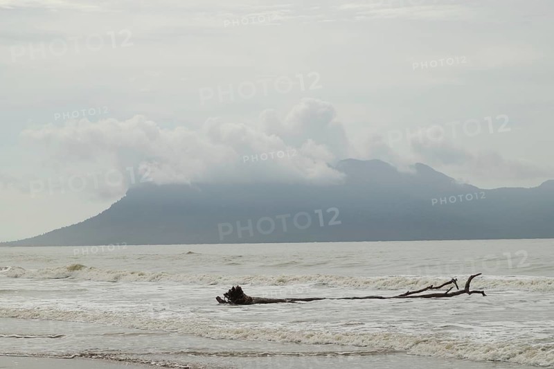 Bako national park, sea sandy beach, waves, overcast, cloudy day, sky and sea. Vacation, travel, tropics concept, no people, Malaysia, Kuching, Asia