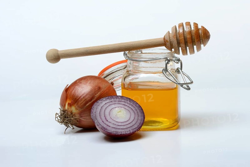Honey in a jar and onions, ingredients for cough syrup