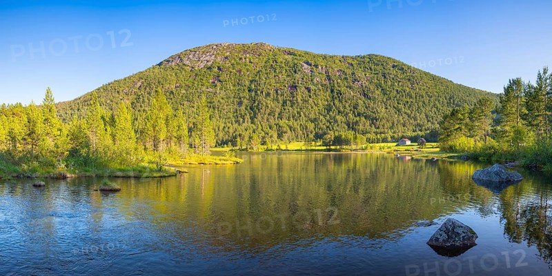 A small lake near Vinje, landscape format, inland water, shore, mountain, landscape shot, panorama shot, cloudless blue sky, summer, evening light, Vestfold og Telemark, Edland, Norway, Europe