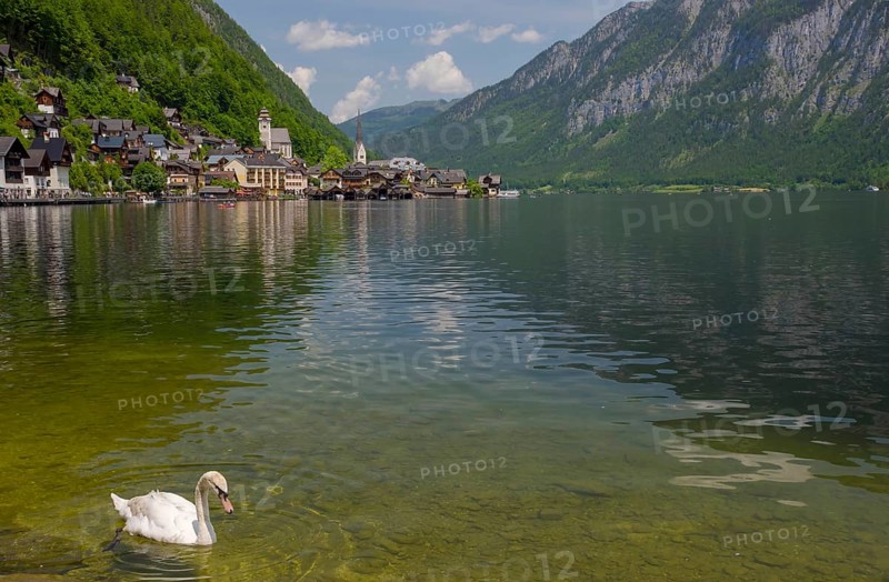 Hallstatt, a charming village on the Hallstattersee lake and a famous tourist attraction, with beautiful mountains surrounding it, in Salzkammergut region, Austria, in summer sunny day, Europe