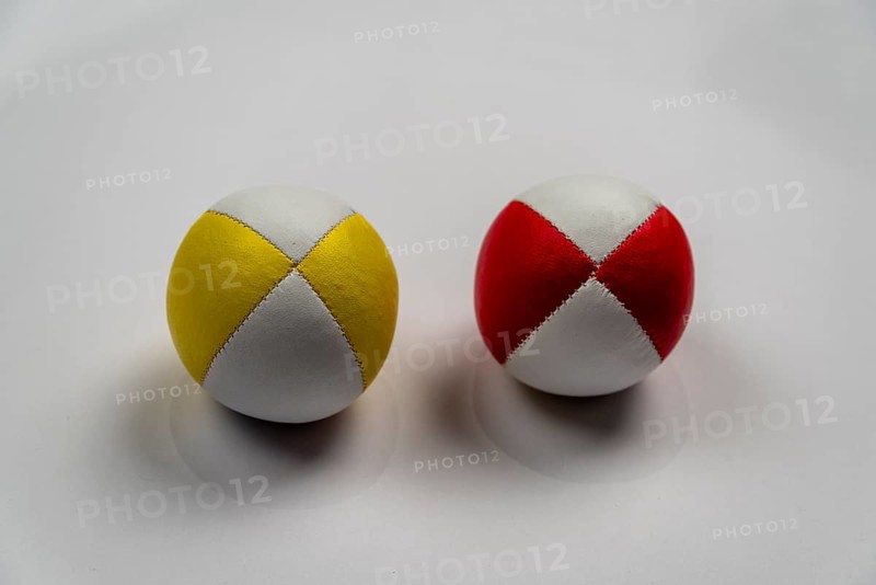 Two juggling balls in front of a white background, studio shot, Germany, Europe