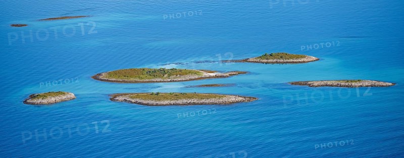 Rocky islands in the evening light, sea with archipelago islands, Ulvagsundet, Vesteralen, Norway, Europe