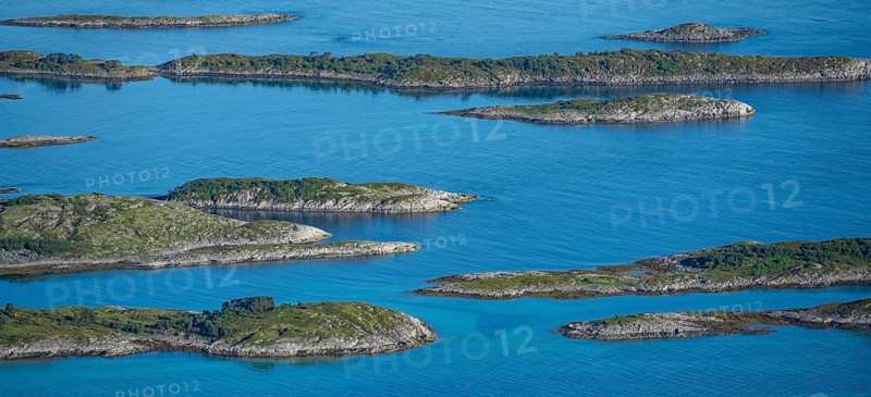 Rocky islands in the blue sea, sea with archipelago islands, Ulvagsundet, Vesteralen, Norway, Europe