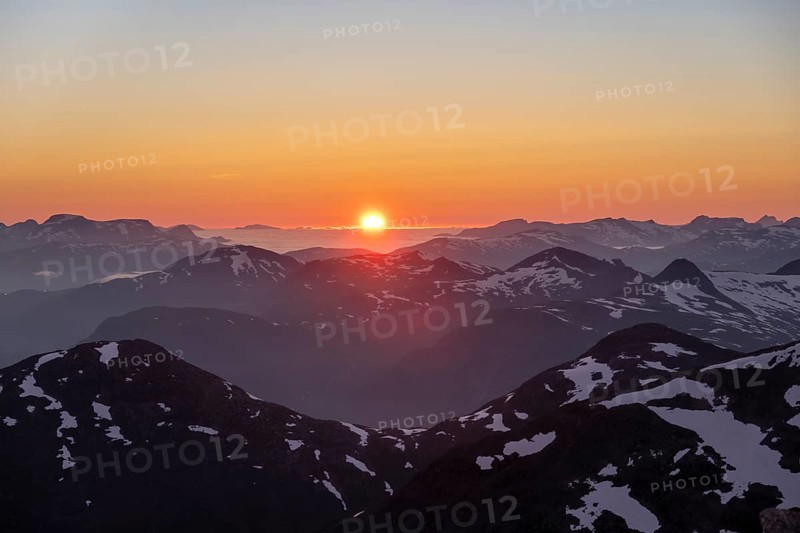 Sunset behind the mountains, mountain panorama with remnants of snow from the summit of Skala, Loen, Norway, Europe