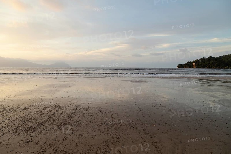 Bako national park, sea sandy beach, overcast, cloudy sunset, sky and sea, low tide. Vacation, travel, tropics concept, no people, Malaysia, Kuching, Asia