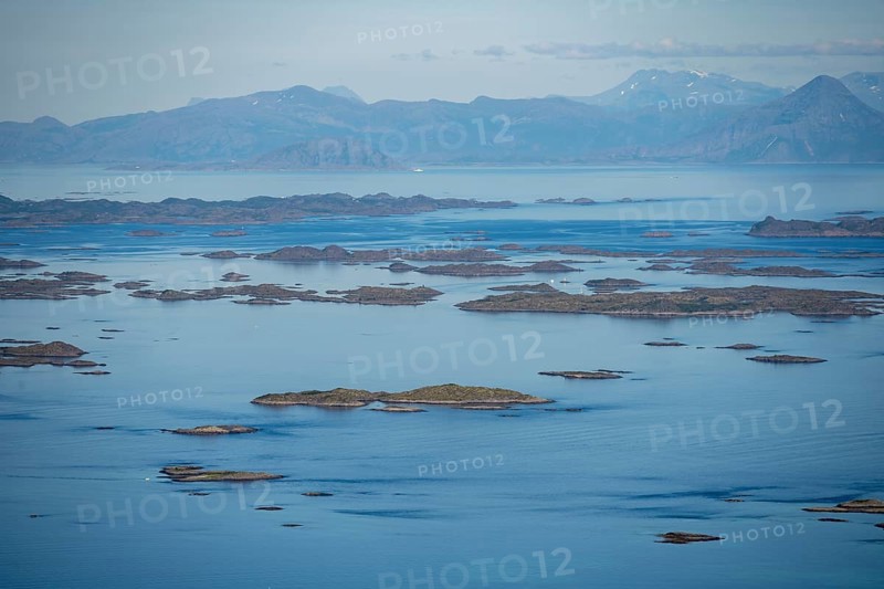 View of the sea with archipelago islands from Svellingsflaket and mountains, from Dronningsvarden or Stortinden, Vesteralen, Norway, Europe