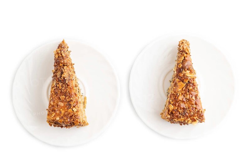 Walnut and hazelnut cake with caramel cream isolated on white background. top view, flat lay