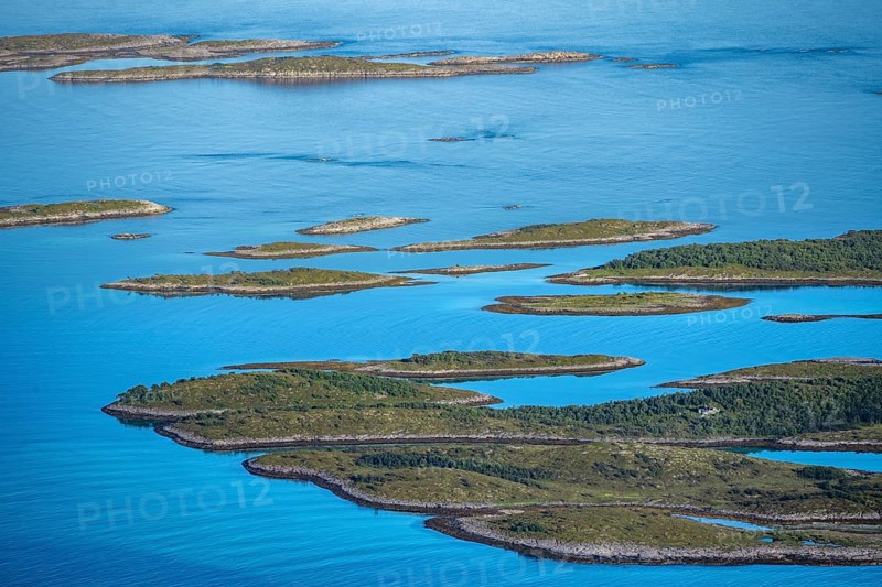 Rocky islands in the blue sea, sea with archipelago islands, Ulvagsundet, Vesteralen, Norway, Europe
