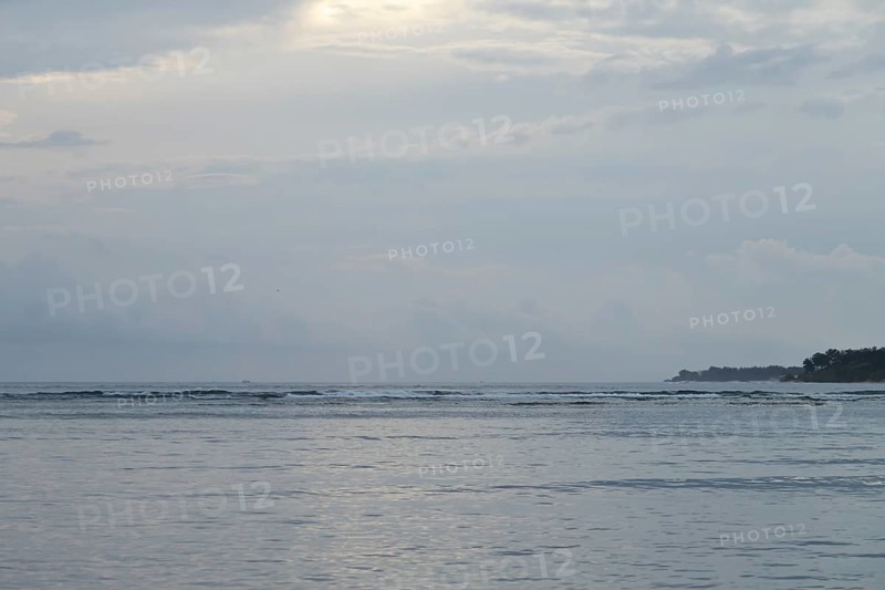 Lombok and Gili Air islands, overcast, cloudy day, sky and sea. Vacation, travel, tropics concept, no people. Sunset, sand beach