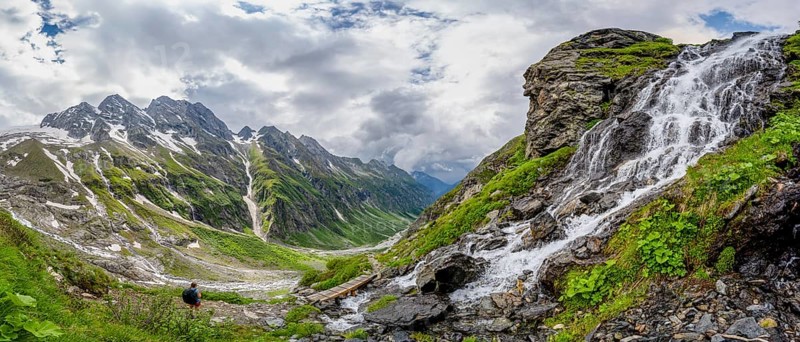 Panorama, green mountain valley Floitengrund with mountain stream Floitenbach, mountaineer on a hiking trail, waterfall on a mountain slope, ascent to Greizer Huette, Berliner Hoehenweg, Zillertal Alps, Tyrol, Austria, Europe
