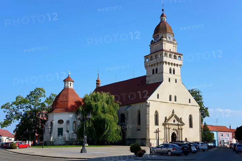 A Gothic church with a striking onion dome under a clear blue sky, St Michael's Roman Catholic Parish Church, Skalica, Skalica, Trnavsky kraj, Slovakia, Europe